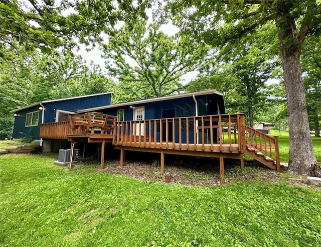 12185 Oak Meadow Dr, Rolla, MO 65401 - back of property with a deck, a yard, and central AC unit