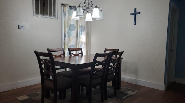 315 County Road 4170, Salem, MO 65560 - dining space featuring wood finished floors, a chandelier, and baseboards