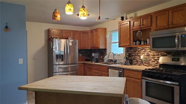 315 County Road 4170, Salem, MO 65560 - kitchen with stainless steel appliances, a sink, tasteful backsplash, butcher block countertops, and brown cabinets
