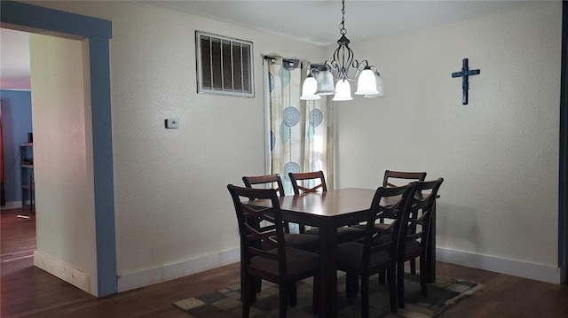 315 County Road 4170, Salem, MO 65560 - dining area with wood finished floors, baseboards, and a chandelier