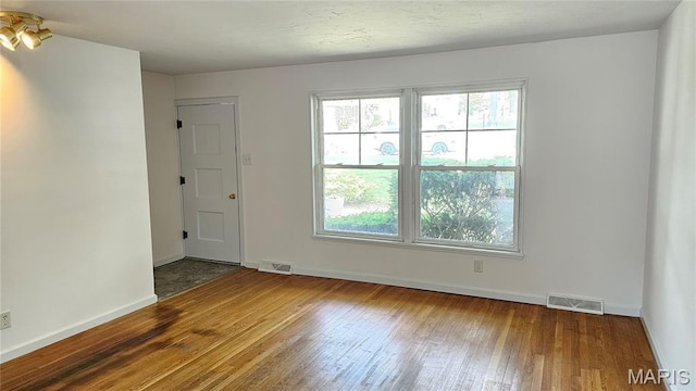 9117 Tiber Ct, Affton, MO 63123 - unfurnished room with hardwood / wood-style floors and plenty of natural light