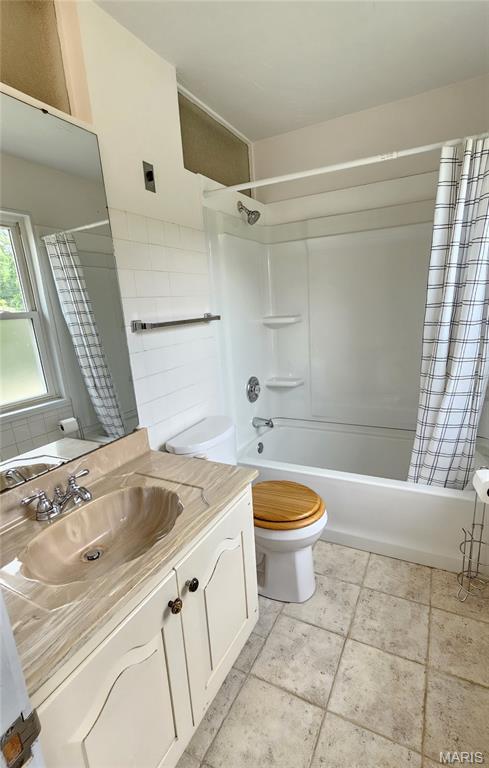 9117 Tiber Ct, Affton, MO 63123 - bathroom featuring vanity and shower / tub combo