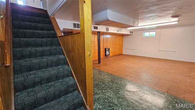 9117 Tiber Ct, Affton, MO 63123 - basement with stairway, tile patterned floors, and heating unit