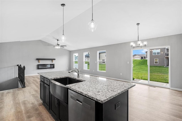 1448 Guilford Pl, Troy, IL 62294 - kitchen featuring stainless steel dishwasher, open floor plan, dark cabinetry, vaulted ceiling, and a sink