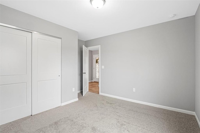 1448 Guilford Pl, Troy, IL 62294 - unfurnished bedroom featuring baseboards, light colored carpet, and a closet