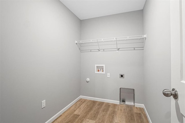 1448 Guilford Pl, Troy, IL 62294 - laundry room featuring washer hookup, electric dryer hookup, light wood finished floors, baseboards, and gas dryer hookup