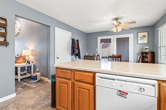 1507 Fox Den, Farmington, MO 63640 - kitchen featuring dishwasher, a ceiling fan, baseboards, and light countertops