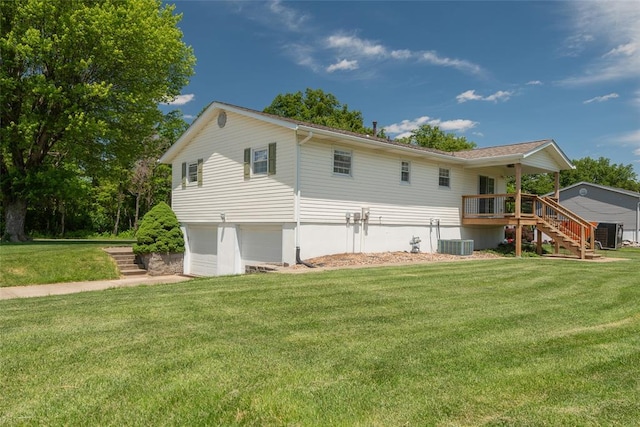 8800 Country Ln, Troy, IL 62294 - rear view of house featuring stairway, a garage, a yard, and central AC