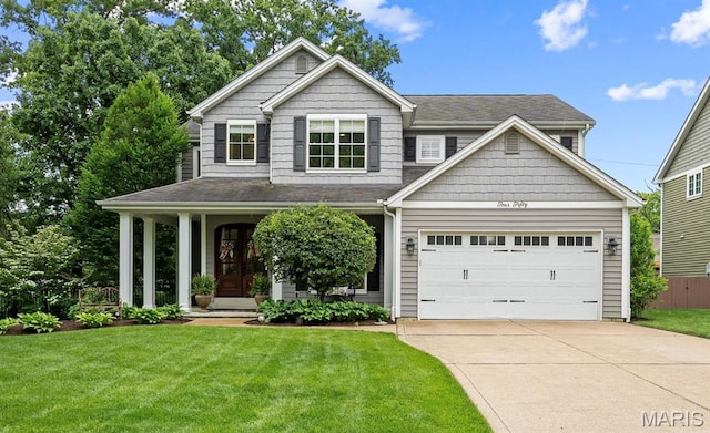 450 Bogey Ln, Kirkwood, MO 63122 - view of front of home featuring concrete driveway, a garage, and a shingled roof