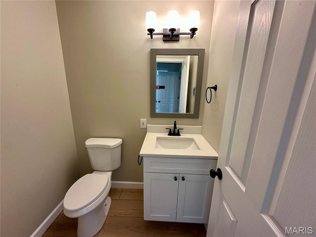1724 Shadow Rdg, Columbia, IL 62236 - bathroom with toilet, vanity, baseboards, and wood finished floors