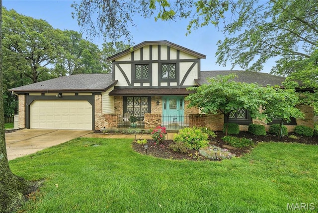 15900 Woodlet Way Ct, Chesterfield, MO 63017 - tudor-style house with an attached garage, a front lawn, driveway, and a porch