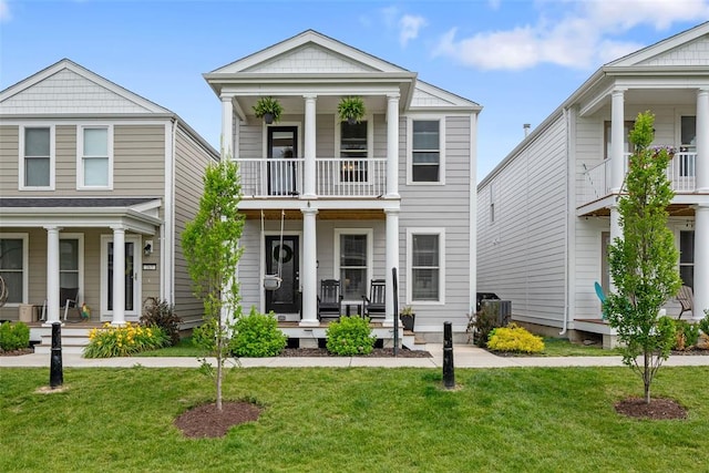 369 Tiber Pl, Saint Charles, MO 63301 - greek revival inspired property featuring a porch, a balcony, and a front lawn