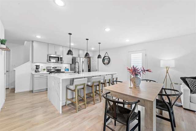 369 Tiber Pl, Saint Charles, MO 63301 - dining space with recessed lighting, light wood-style floors, and baseboards