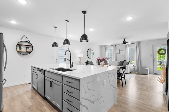 369 Tiber Pl, Saint Charles, MO 63301 - kitchen with a sink, gray cabinetry, open floor plan, appliances with stainless steel finishes, and a ceiling fan