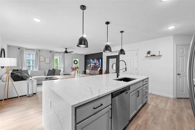 369 Tiber Pl, Saint Charles, MO 63301 - kitchen featuring dishwasher, a sink, gray cabinets, light wood finished floors, and recessed lighting