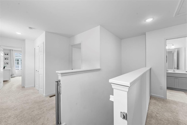 369 Tiber Pl, Saint Charles, MO 63301 - hallway with an upstairs landing, light carpet, recessed lighting, baseboards, and attic access