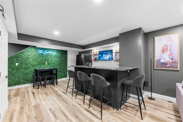 369 Tiber Pl, Saint Charles, MO 63301 - indoor bar featuring freestanding refrigerator, light wood finished floors, baseboards, and recessed lighting