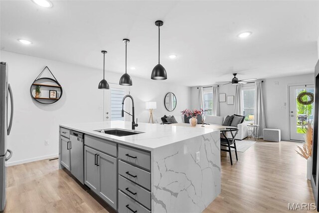 369 Tiber Pl, Saint Charles, MO 63301 - kitchen with a sink, gray cabinets, open floor plan, appliances with stainless steel finishes, and a ceiling fan