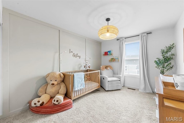 369 Tiber Pl, Saint Charles, MO 63301 - carpeted bedroom featuring a crib and baseboards
