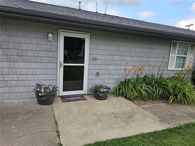 202 Jeremiah, Willisville, IL 62997 - doorway to property with a patio and a shingled roof