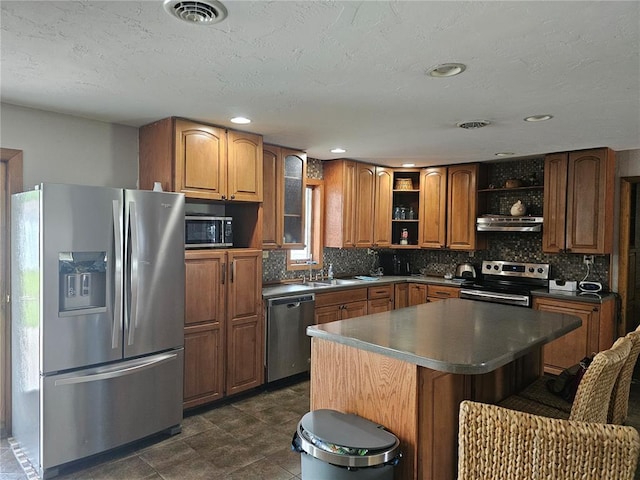 202 Jeremiah, Willisville, IL 62997 - kitchen with appliances with stainless steel finishes, open shelves, exhaust hood, a kitchen bar, and tasteful backsplash