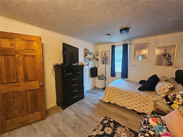 202 Jeremiah, Willisville, IL 62997 - bedroom featuring light wood-style floors and a textured ceiling