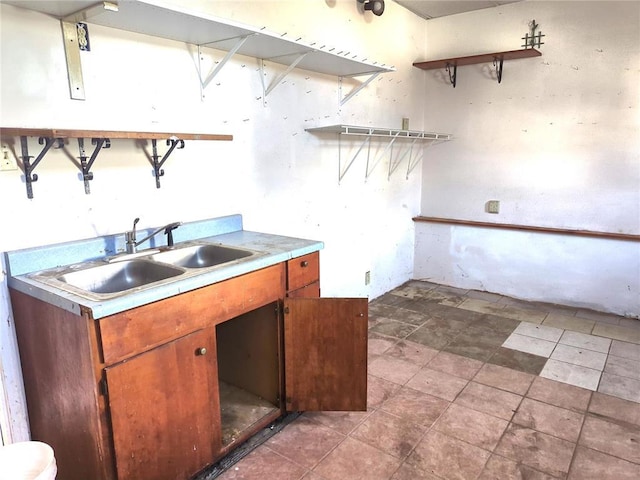 7116 Edison Ave, Velda City, MO 63121 - kitchen featuring open shelves, a sink, brown cabinetry, and light countertops