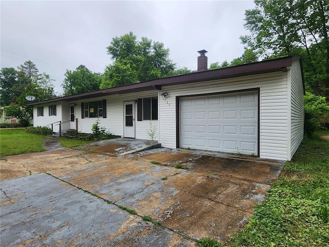 1505 Dale St, Van Buren, MO 63965 - ranch-style house with driveway, a chimney, and an attached garage