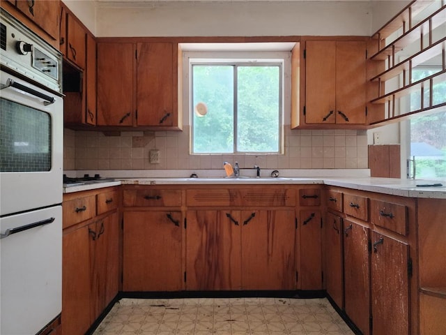 1505 Dale St, Van Buren, MO 63965 - kitchen featuring light flooring, light countertops, a sink, and tasteful backsplash