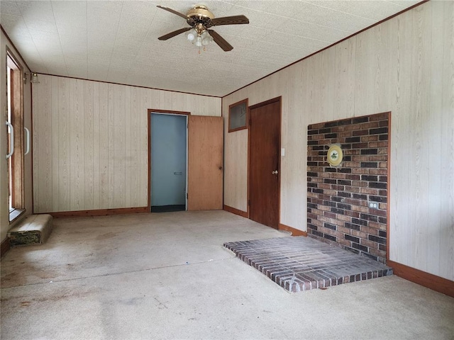 1505 Dale St, Van Buren, MO 63965 - unfurnished room with a ceiling fan, wooden walls, carpet flooring, and baseboards