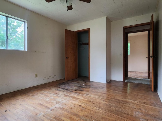 1505 Dale St, Van Buren, MO 63965 - unfurnished bedroom featuring wood finished floors, a closet, and a ceiling fan