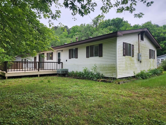 1505 Dale St, Van Buren, MO 63965 - view of front of home with a deck, central AC unit, and a front lawn