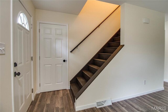 615 Saint Peter Dr, Godfrey, IL 62035 - foyer entrance featuring stairway, wood finished floors, and baseboards