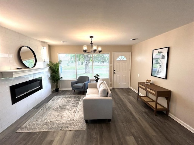 436 S 5th St, Caseyville, IL 62232 - living room featuring a fireplace, dark wood-style flooring, and baseboards
