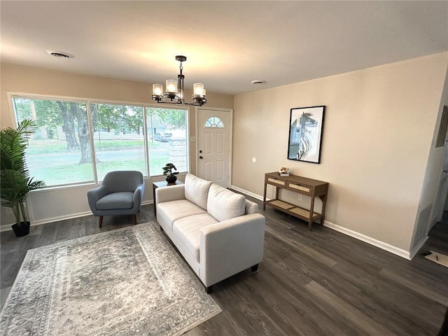 436 S 5th St, Caseyville, IL 62232 - living area with baseboards, dark wood-style flooring, and a chandelier