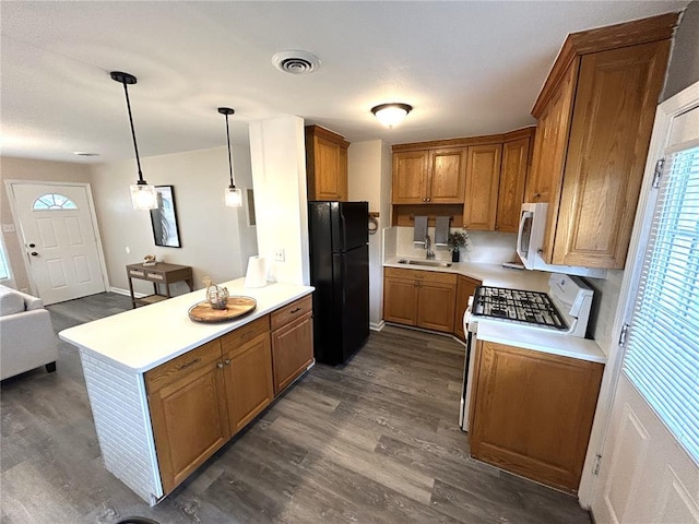 436 S 5th St, Caseyville, IL 62232 - kitchen with white appliances, dark wood-type flooring, brown cabinetry, and a sink