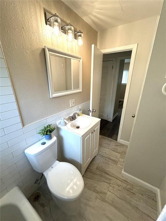 436 S 5th St, Caseyville, IL 62232 - full bath with vanity, toilet, a bath, and tile walls