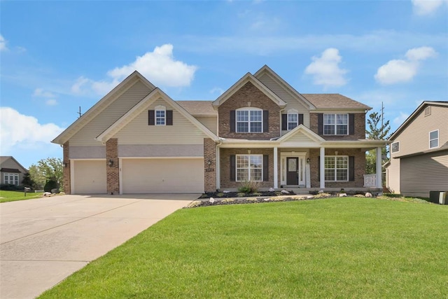 1002 Brook Mont Dr, Ofallon, MO 63366 - view of front facade with brick siding, driveway, a front yard, a porch, and an attached garage