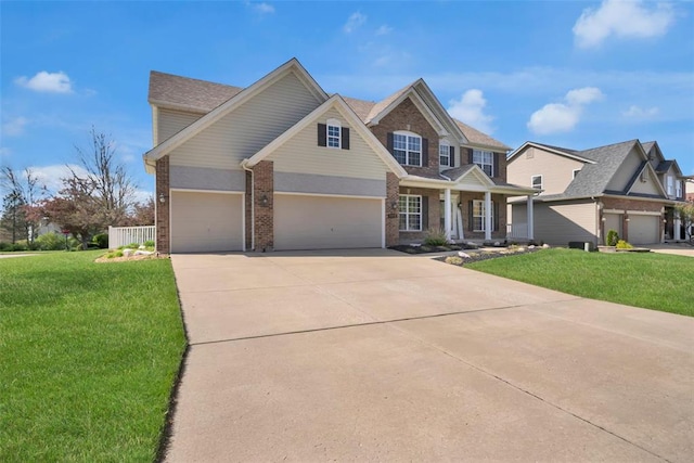 1002 Brook Mont Dr, Ofallon, MO 63366 - view of front of property featuring covered porch, brick siding, an attached garage, and a front lawn