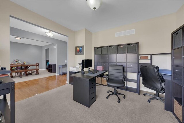 1002 Brook Mont Dr, Ofallon, MO 63366 - office area featuring light carpet, baseboards, and light wood-style floors
