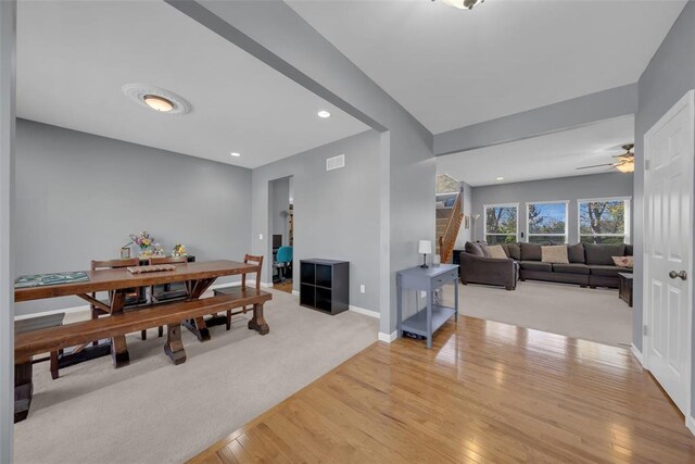1002 Brook Mont Dr, Ofallon, MO 63366 - dining area with light wood-style floors, stairway, a ceiling fan, baseboards, and recessed lighting