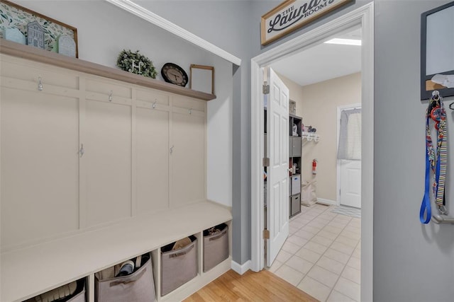1002 Brook Mont Dr, Ofallon, MO 63366 - mudroom featuring baseboards and light tile patterned floors
