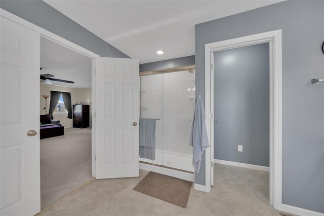 1002 Brook Mont Dr, Ofallon, MO 63366 - full bath featuring a stall shower, ceiling fan, and baseboards