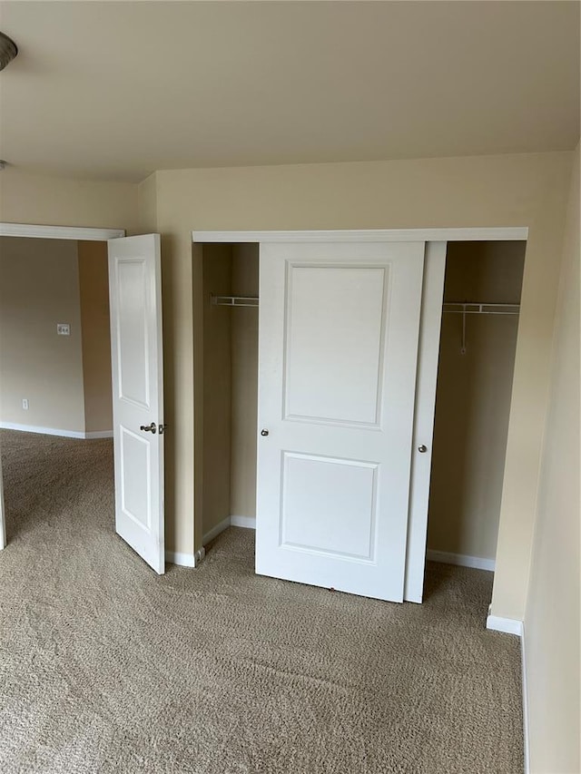 333 Bramblett Hls, Ofallon, MO 63366 - unfurnished bedroom featuring light carpet and baseboards