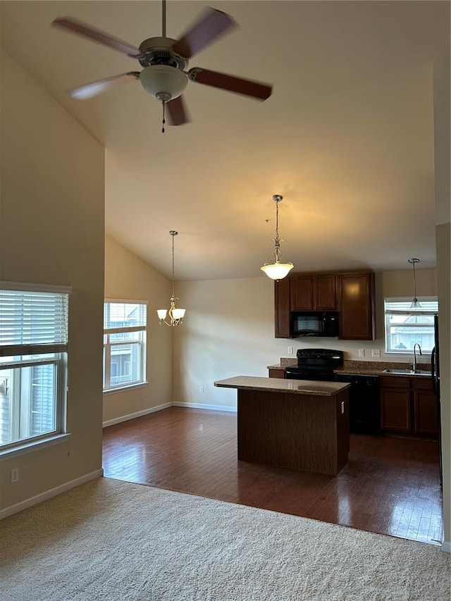 333 Bramblett Hls, Ofallon, MO 63366 - kitchen featuring black appliances, a sink, a center island, dark wood finished floors, and vaulted ceiling