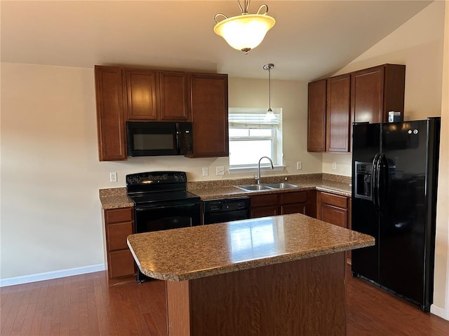 333 Bramblett Hls, Ofallon, MO 63366 - kitchen with black appliances, a sink, pendant lighting, dark wood-style flooring, and vaulted ceiling