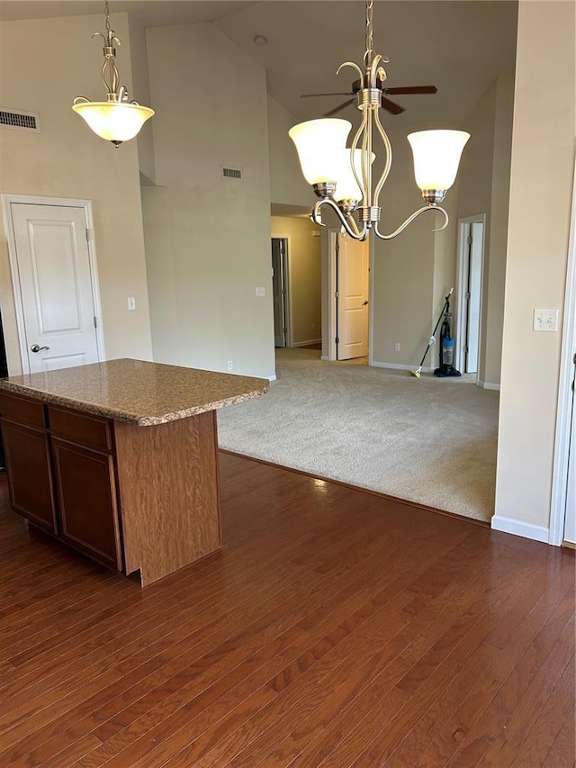 333 Bramblett Hls, Ofallon, MO 63366 - kitchen featuring high vaulted ceiling, a chandelier, open floor plan, a kitchen island, and dark wood finished floors