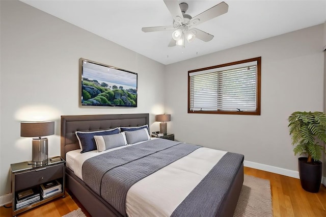 5812 Birch Hollow Dr, Oakville, MO 63129 - bedroom featuring baseboards, wood finished floors, and ceiling fan