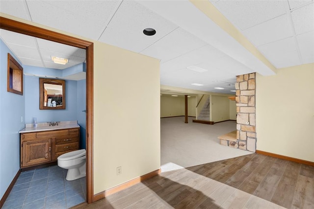 5812 Birch Hollow Dr, Oakville, MO 63129 - interior space featuring baseboards, toilet, a drop ceiling, and vanity
