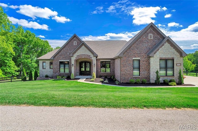 1314 Top Of The Hill Rd, Chesterfield, MO 63005 - french country home featuring brick siding, stone siding, roof with shingles, and french doors